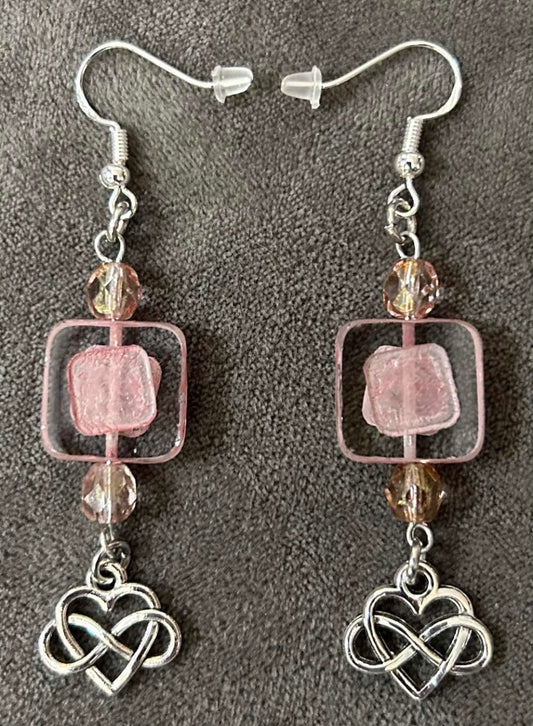 Decorative focal Czech glass bead & smaller Czech glass pink beads. The charm is an infinity heart representing forever love.