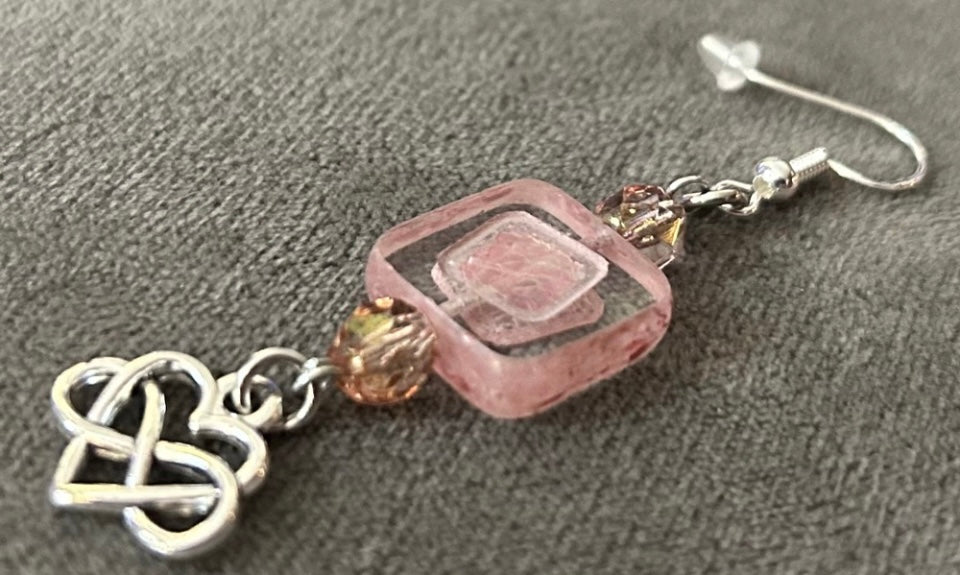 Decorative focal Czech glass bead & smaller Czech glass pink beads. The charm is an infinity heart representing forever love.